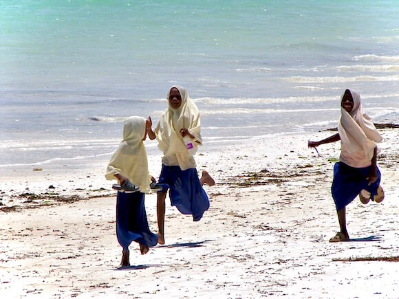 girls running on beach
