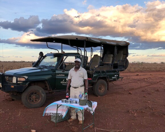 guide setting up sundowners on a Kenya safari holiday