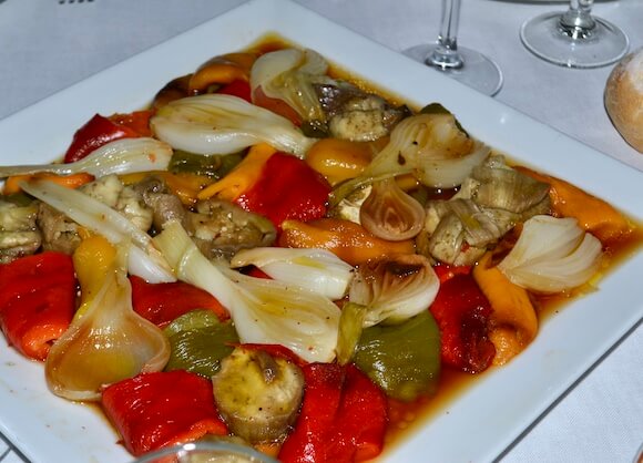 roasted vegetables on plate peppers, onions and artichoke hearts