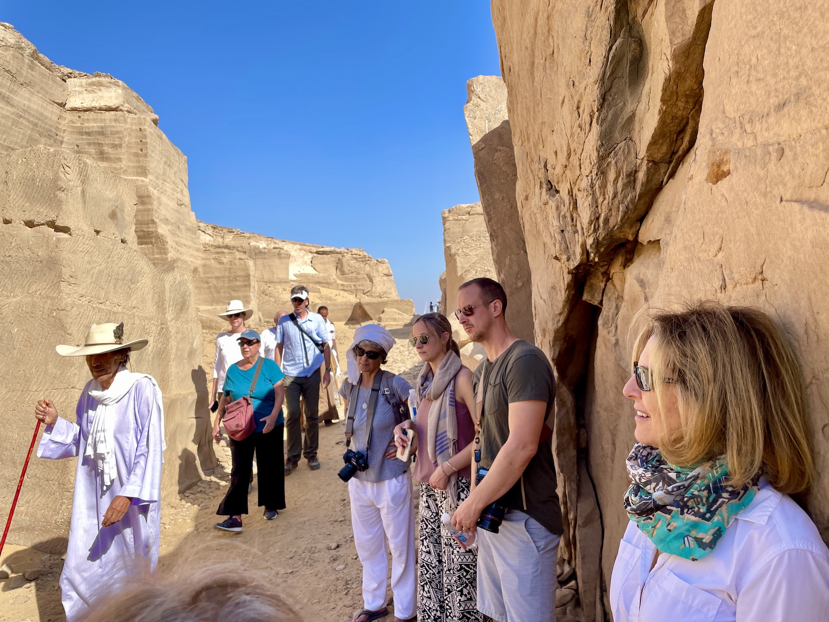 men and women visiting rock quarry in Egypt