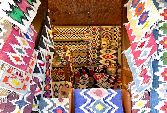 Brightly colored woven carpets with a geometric pattern