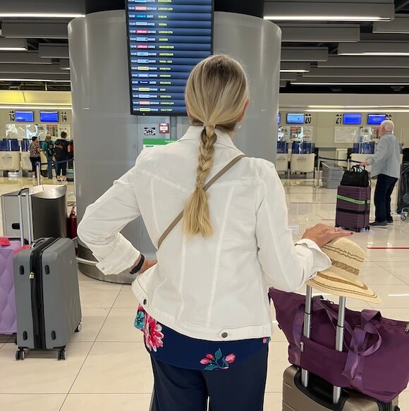 woman in white jacket travel solo